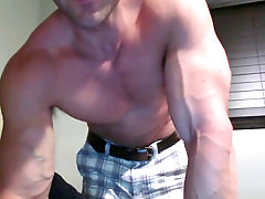 Beefy guy oils up his dick and masturbates on cam