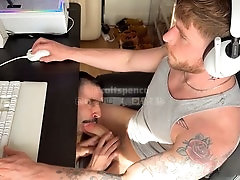 Colt Spence gets worshipped under the desk by Nick Charms while gaming