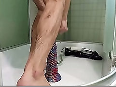 I jump on a big dildo and squirt from my dick