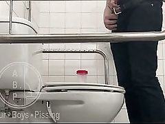 In the Hospital Toilets, a Guy Pisses Into a Cup for a Urine Sample, Then Gets Horny, Jerks-off and Cums