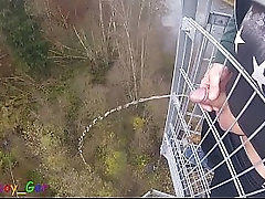 I pee outside from a very public observation tower and then masturbate my penis, and my balls are fat. But then people came along...