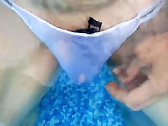 Slut in white panties having fun in the pool