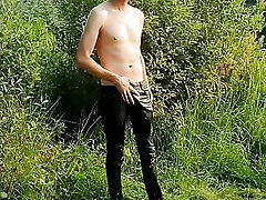Twink getting soaked and showing ass and cock in public