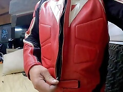 Fit guy in leather suit does a sexy striptease and masturbation with his giant cock