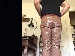 Me stroking in my brown glossy pvc trousers