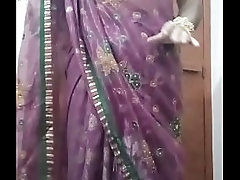 Indian Gay Crossdresser Bottom Gaurisissy pressing and playing with her big boobs in purple saree with heavy jwellery