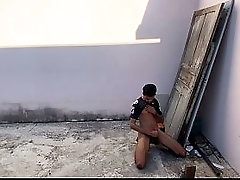 Skinny guy with a big dick jerking off in the street